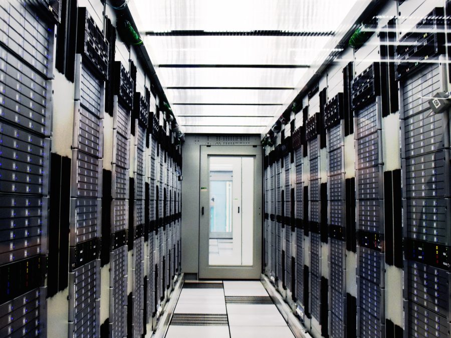 Network operations center — the monitoring wall on a live shift